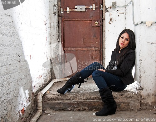 Image of Girl sitting in basement