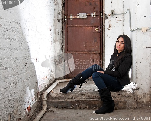 Image of Girl sitting in basement