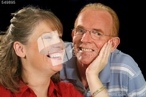 Image of Middle Aged Couple Holding