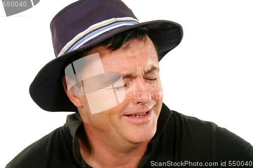 Image of Man In Hat Crying