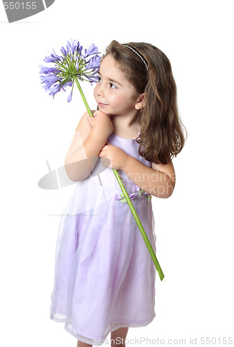 Image of Pretty girl holding a flower