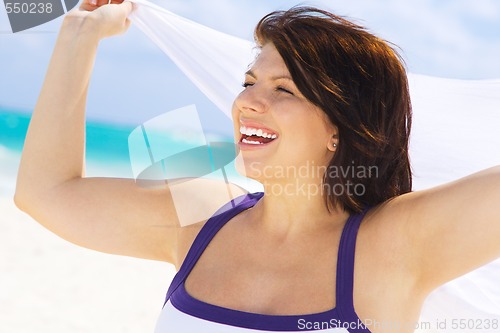 Image of happy woman with white sarong