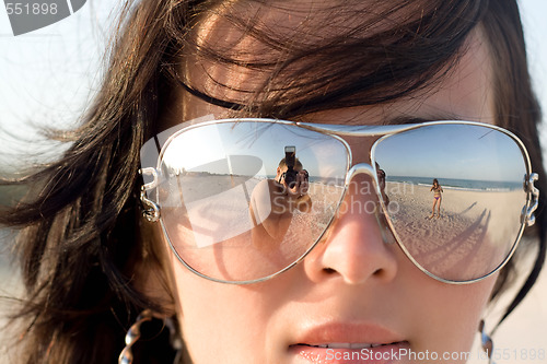 Image of Reflexion of the photographer in model glasses