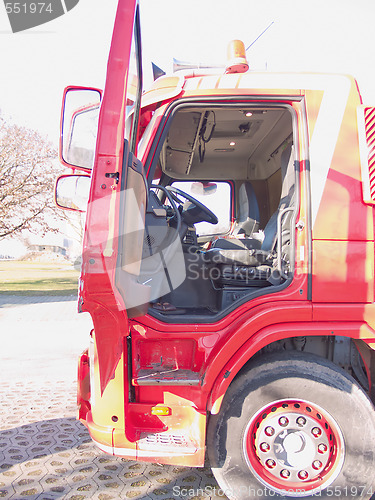 Image of Drivers side door opening of a red truck