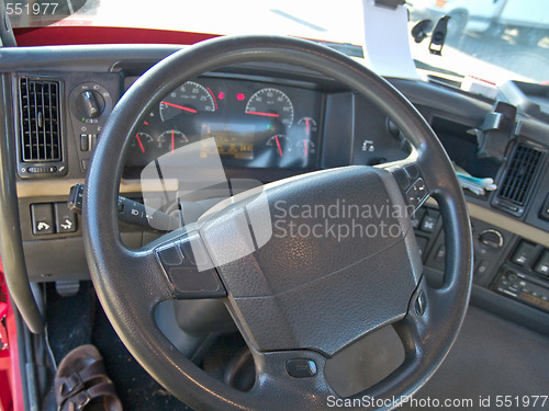 Image of Steering wheel and instrument panel of a truck