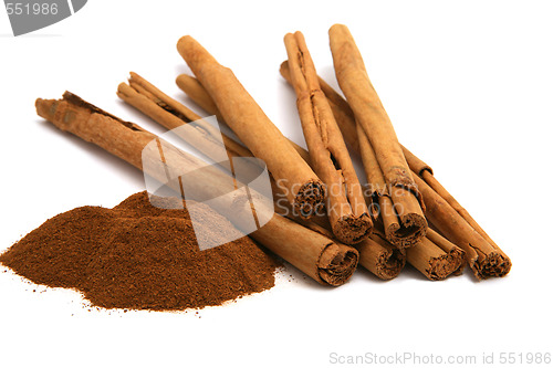 Image of cinnamon powder and bark isolated on white