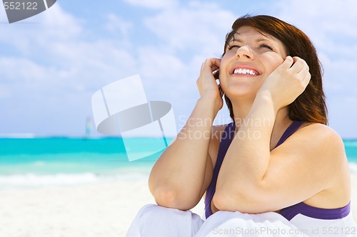 Image of happy woman on the beach