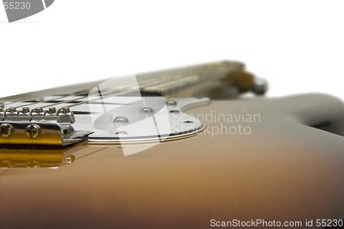 Image of Electric guitar focused on the tremolo and bridge pickup