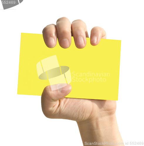 Image of yellow card in woman hand
