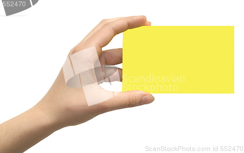 Image of yellow card in a hand