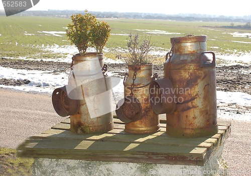 Image of Milk cans 50 years old.