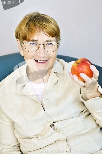 Image of Elderly woman with apple