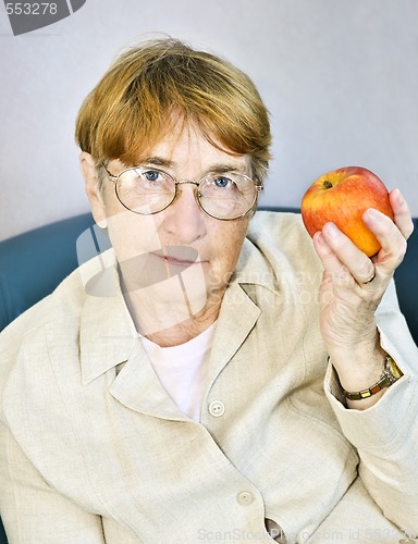 Image of Elderly woman with apple
