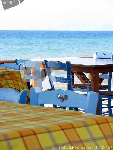 Image of Blue chairs by the sea