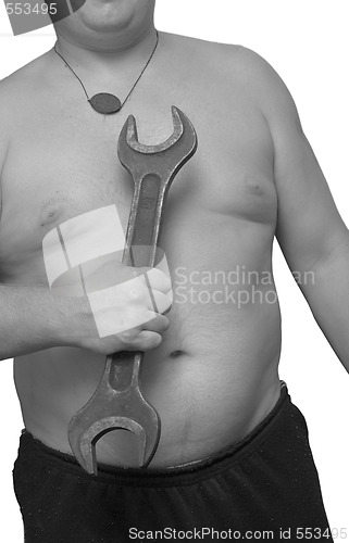 Image of wrench in male hand