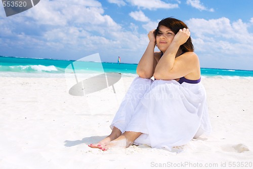 Image of happy woman with white sarong