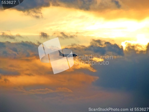 Image of Sunset sky and airplane