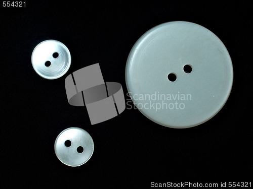 Image of three white buttons