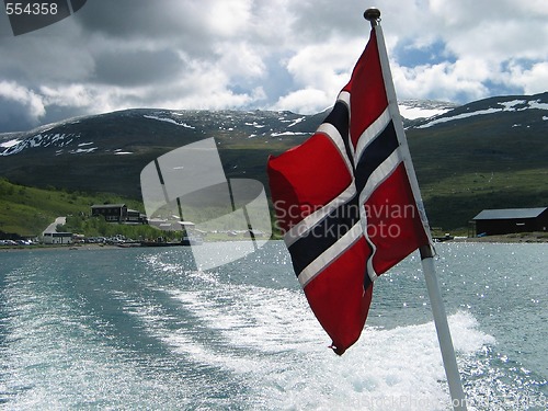 Image of Norwegian flag on a stern of a boat 