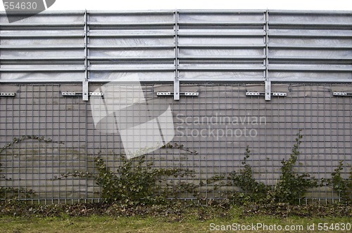 Image of High concrete and aluminum wall