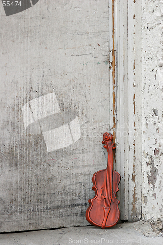 Image of violin by the door