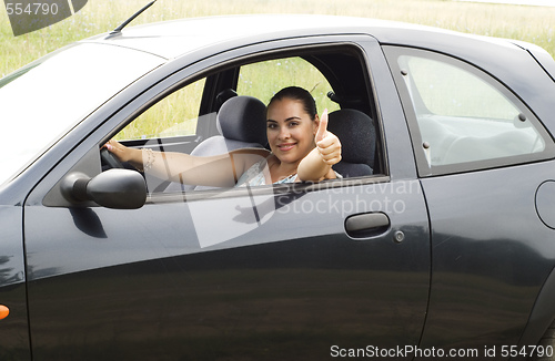 Image of happy woman in the car