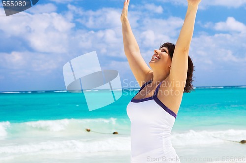 Image of happy woman on the beach