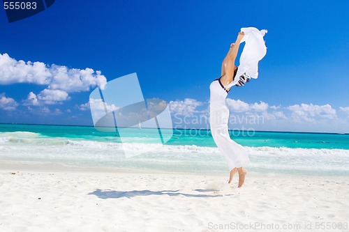 Image of happy woman with white sarong