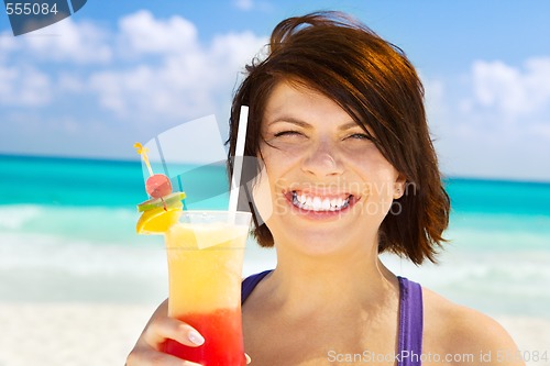 Image of happy woman with colorful cocktail