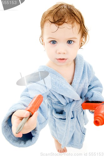 Image of baby boy with toy tools