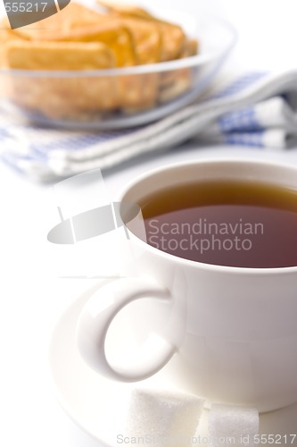 Image of cup of tea, sugar and cookies