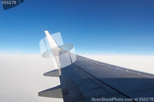 Image of Airplane wing above the clouds 