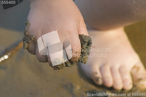Image of child's hand with sand