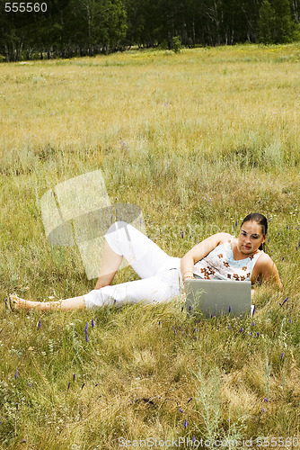 Image of woman on the grass with laptop