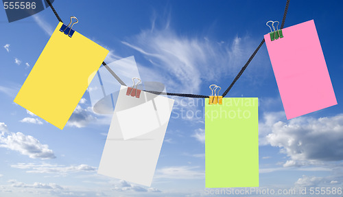 Image of color notes on a blue sky 