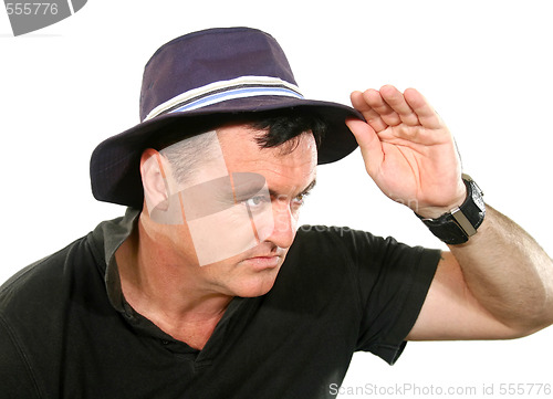Image of Man Looks Away In Hat