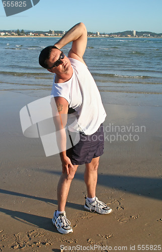 Image of Stretching Exercises On The Beach