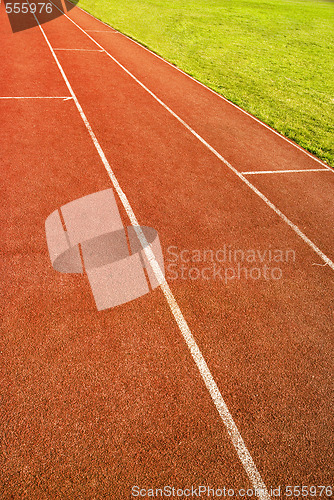 Image of green grass and running track