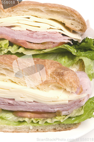 Image of gourmet ham swiss cheese sandwich on croissant bread