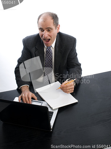 Image of excited executive in office