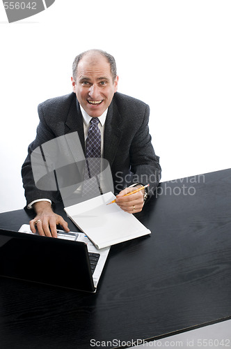 Image of excited executive in office