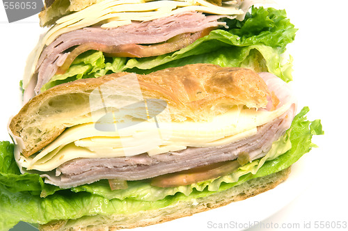 Image of gourmet ham swiss cheese sandwich on croissant bread