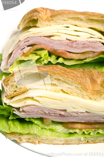 Image of gourmet ham swiss cheese sandwich on croissant bread