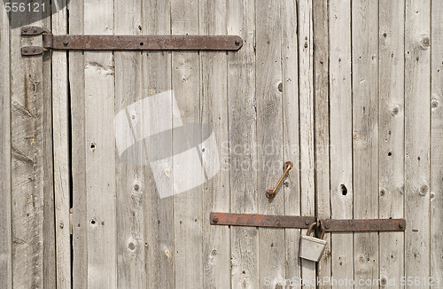 Image of lock and wooden gate