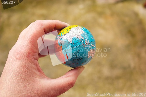 Image of globe in hand