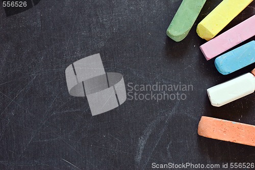 Image of blackboard with coloured crayons