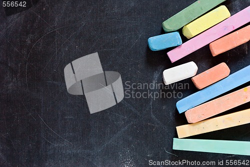 Image of blackboard with coloured crayons