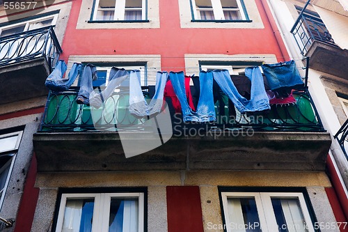 Image of Jeans dried on a balcony