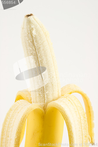 Image of One cleared banana on light background