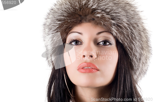 Image of Portrait of the young woman in a fur cap